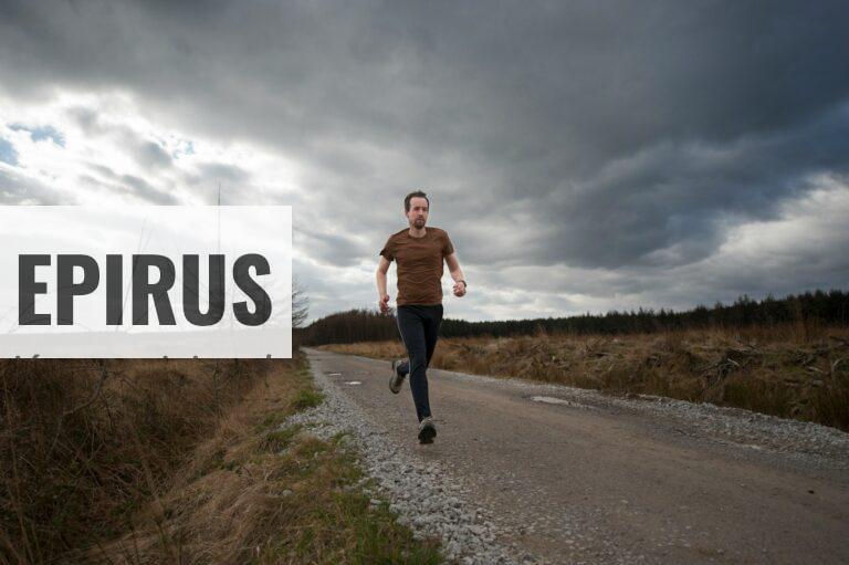 man running at the road during daytime