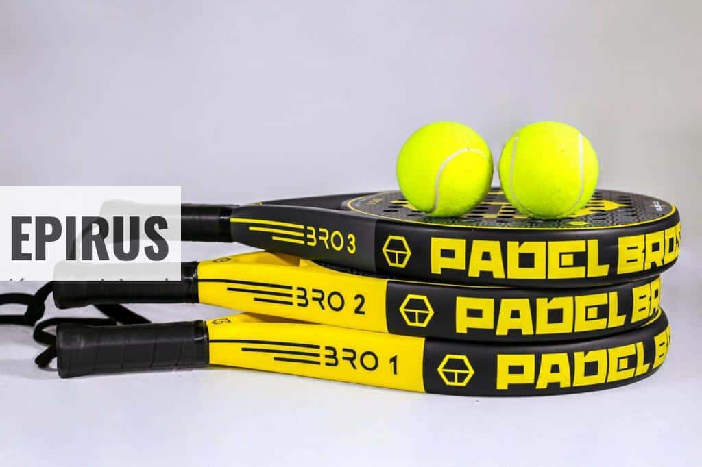 Vibrant padel rackets and tennis balls on white backdrop, ideal for sports themes.