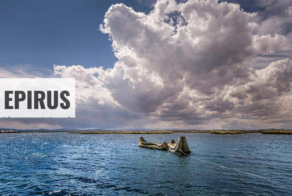 A serene view of a canoe on a lake under dramatic clouds in Peru.
