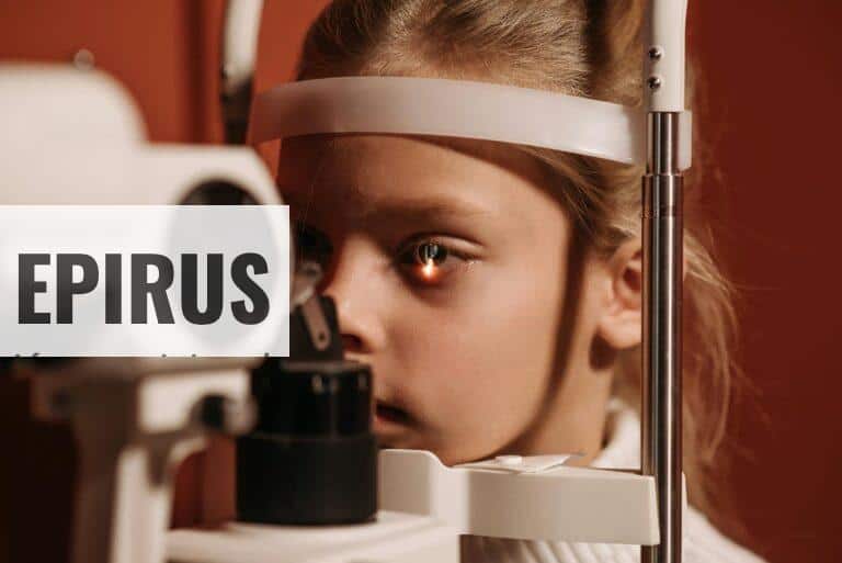 A young girl undergoing an eye exam with advanced ophthalmology equipment, focusing on vision care.